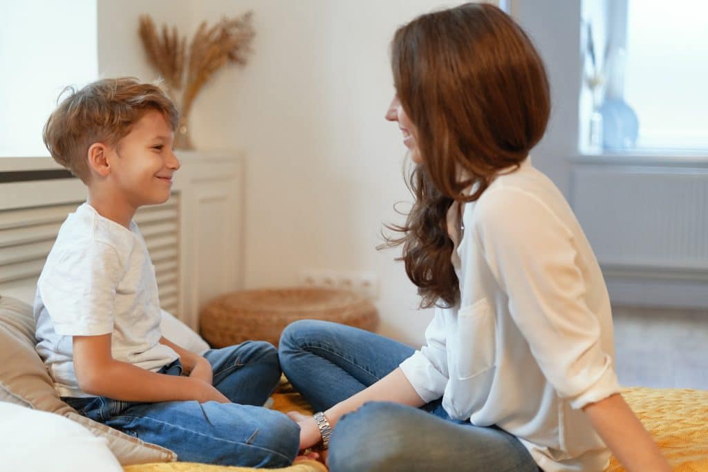 Mom having conversation with young son
