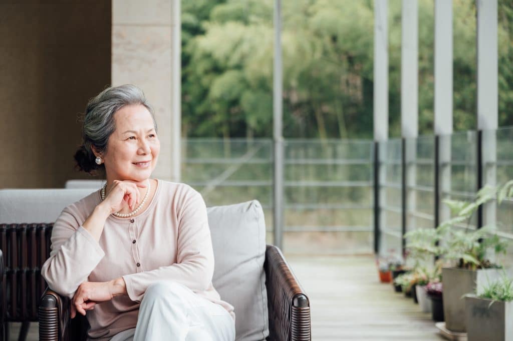 elegant senior woman on balcony