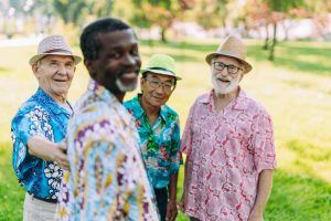 diverse group of seniors in hawaiian shirts