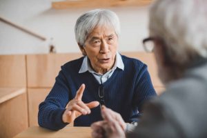 seniors having serious conversation