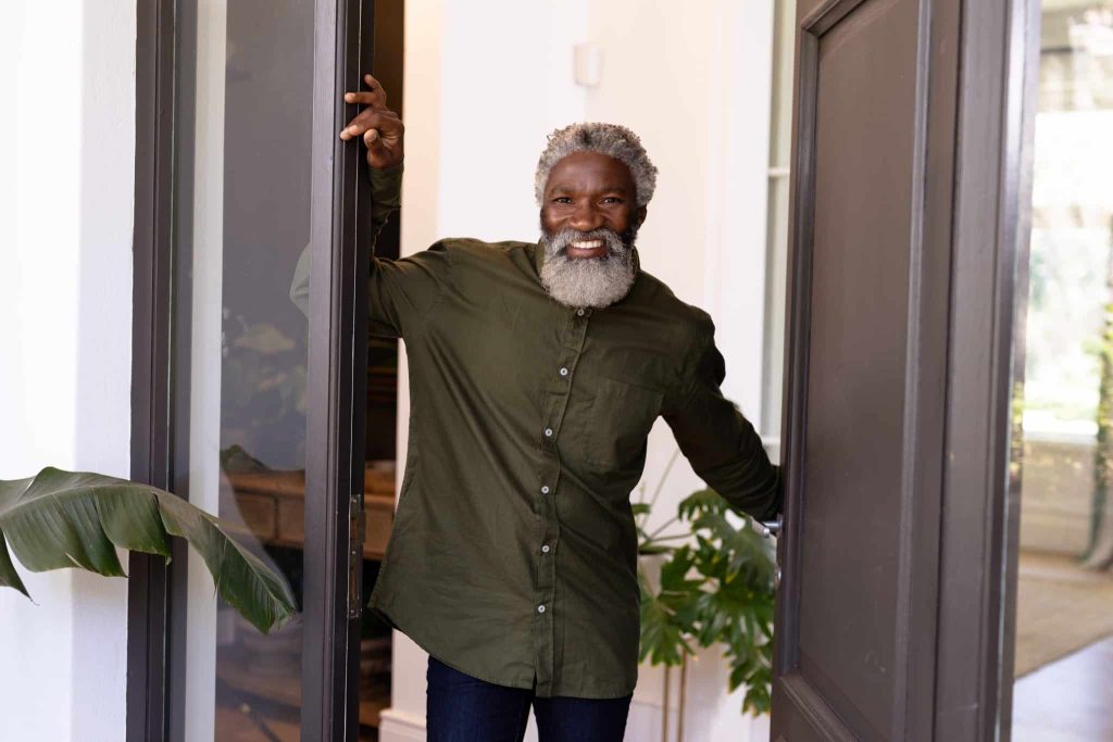 man with beard in doorframe