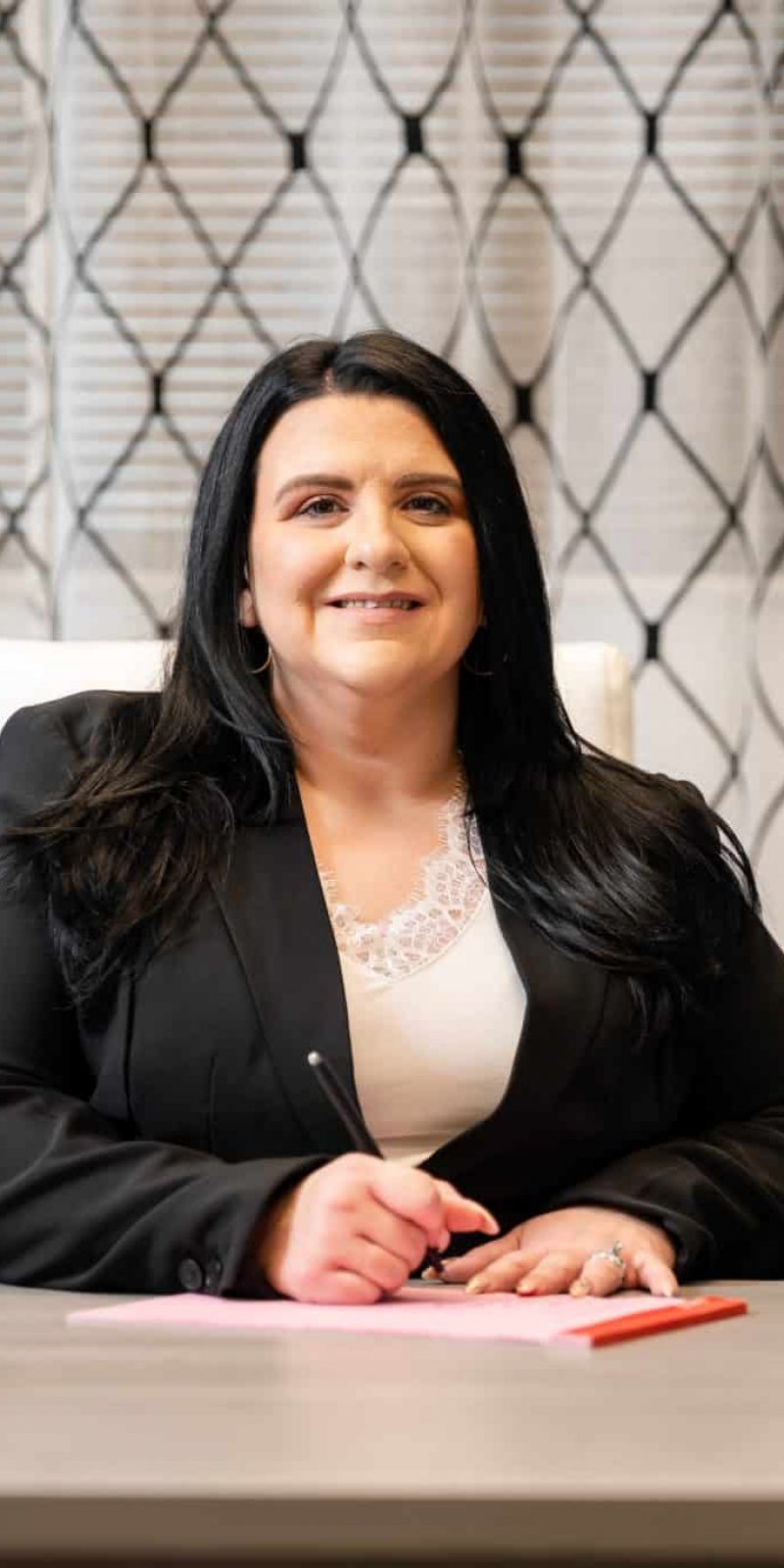 woman smiling at desk